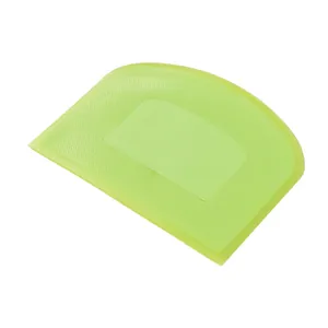 Durable green plastic dough scraper tool for cake decorating and kitchen baking use