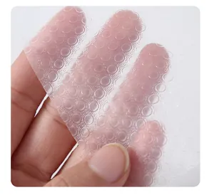 Macro view of transparent EVA drawer liner with circular embossed non-slip texture.