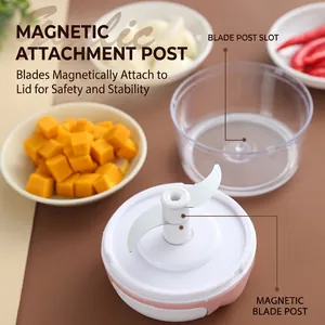 Portable manual garlic chopper and vegetable cutter featuring a magnetic blade shaft