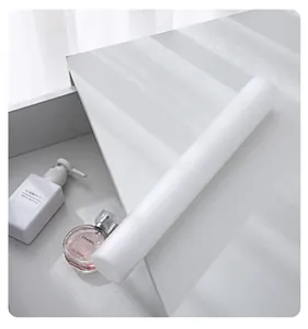 Close-up detail of white EVA drawer liner mat roll on elegant marble surface in drawer