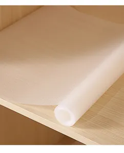 Detailed view of translucent EVA shelf liner with non-slip texture on wooden shelf