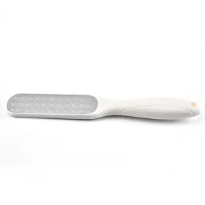 Ergonomic white foot rasp callus remover with textured metal surface for dead skin care