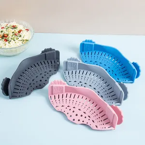 Set of four colorful silicone clip-on pot strainers for kitchen vegetable drainage