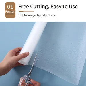 Cuttable non-slip EVA shelf liner for cabinets and drawers being trimmed to size