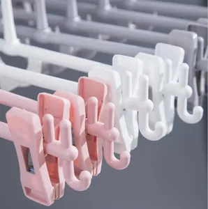Grucce per pantaloni impilabili multistrato in plastica con clip antiscivolo rosa e bianche