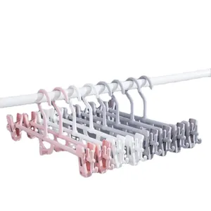 Appendiabiti in plastica impilabili multistrato con clip regolabili per pantaloni e gonne