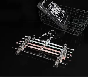 Set of adjustable non-slip stainless steel pants hangers with clips for skirts.