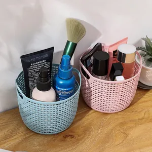 Durable hollow plastic desktop storage baskets in pink and blue for makeup organization
