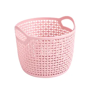 Portable pink hollow plastic storage basket with handles for home desktop organization