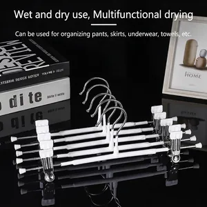 Set of 5 white non-slip stainless steel hangers with clips for pants and skirts
