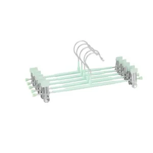 Set of 5 mint green non-slip pants hangers with adjustable stainless steel clips for skirts