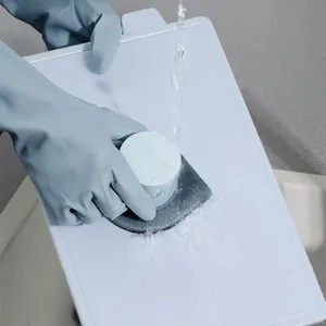 Professional emery sponge cleaning brush for kitchen and bathroom surfaces shown in use
