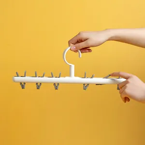 Portable white plastic laundry hanger with 6 clips for socks and underwear drying