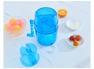 Manual blue translucent ice shaver with hand crank for making homemade smoothies