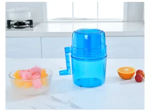Manual blue ice shaver machine on a white marble kitchen counter with bowls of ice.