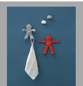 Creative humanoid bathroom wall hooks in red and grey colors holding a white towel