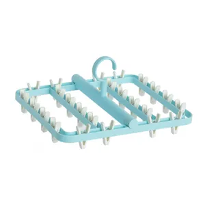 Large light blue plastic drying rack with multiple clips for socks and underwear