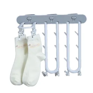 Multifunctional foldable household sock storage rack with press-type clips for drying