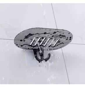 Close-up of a smoke-grey wall-mounted soap dish with waterproof drainage and hooks