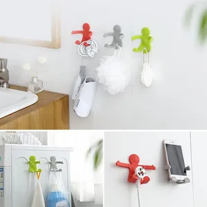 Creative little man hugging wall hooks for bathroom organization and cable management