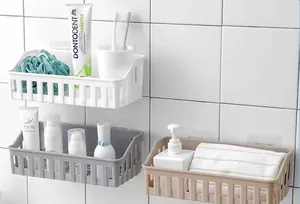Set of three punch-free wall-mounted plastic bathroom storage baskets in white grey and beige