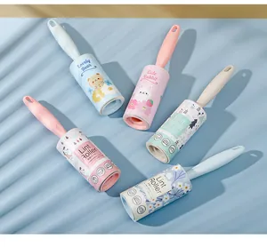 Portable cartoon lint roller with replaceable adhesive core for clothes cleaning.