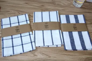 A detailed view of Japanese style linen napkins with striped and plaid patterns