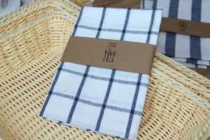 Close-up of Japanese style linen napkins with navy blue checkered and striped patterns