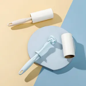 Handheld lint roller set with refill core for clothes dust removal in pastel colors.