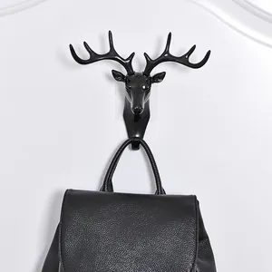Gancio da parete decorativo a testa di cervo nero per appendere cappotti e borse