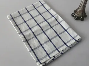 Detail view of Japanese style linen napkin with navy blue checkered grid pattern.