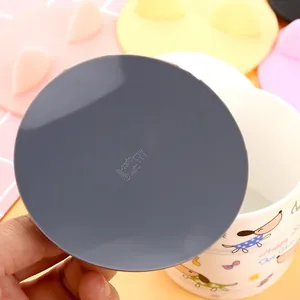 Durable grey cat ear silicone cup lid featuring food-grade heat resistance symbols