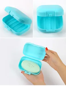 Detailed view of the blue portable travel soap box showing drainage ribs and lid