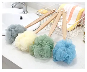 Four colorful long-handled mesh bath sponges with wooden handles for back scrubbing