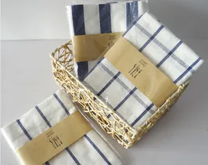 Close-up of Japanese linen napkins with blue stripes and grid patterns in a basket