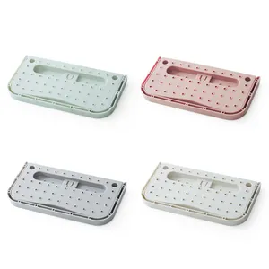 Wall-mounted folding shoe racks in four pastel colors for space-saving bathroom storage
