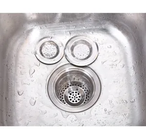 Close-up macro view of stainless steel sink strainer set showing three different sizes