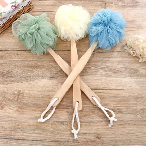 Long handle bath loofah sponge brush set in three soft colors on a wooden surface