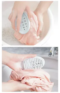 Close-up detail of a light blue silicone soap box used as a laundry brush for hand washing