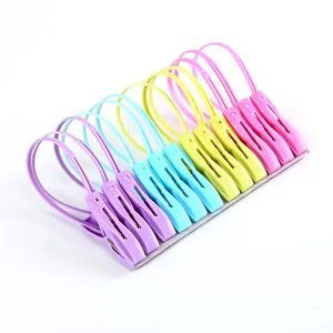Durable multicolor plastic clothespins with integrated hanging loops for drying socks