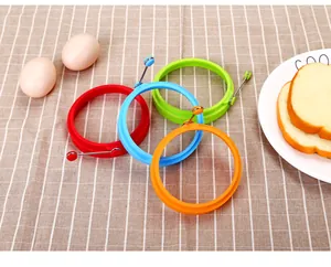 Four colorful silicone egg rings with metal handles for perfectly shaped pancakes and omelets
