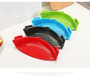 Set of four silicone clip-on pot strainers in red, black, blue, and green for kitchen use