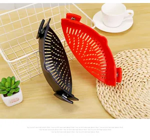 Red and black silicone clip-on pot strainers for kitchen vegetable draining