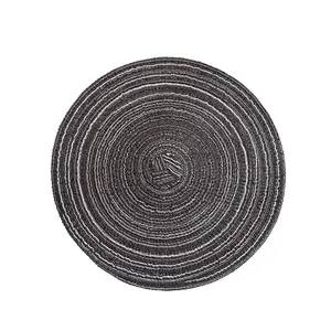 Round woven cotton yarn placemat in dark grey with spiral pattern for table decor