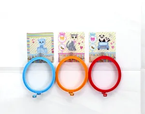 Detail showing blue, orange, and red round silicone egg rings with small handles