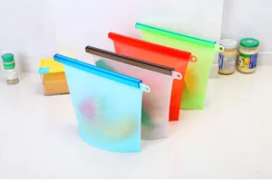 Macro view of colorful silicone food storage bags with measurement markings and seal bars.