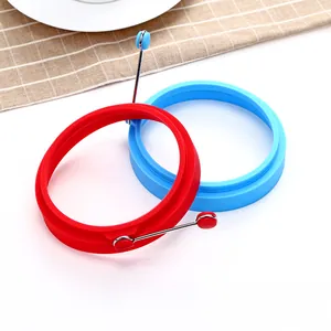 Food grade round silicone egg rings in red and blue with stainless steel handles