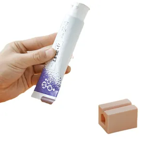 Manual silicone toothpaste squeezer holder for bathroom and facial cleanser tubes