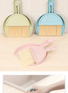 Mini desktop broom and dustpan set with cute cartoon face for keyboard cleaning