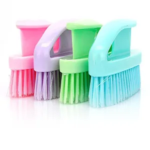 Detailed view of four colorful plastic multi-purpose laundry and shoe cleaning brushes